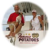 Couple satisfied with their new boat lettering.